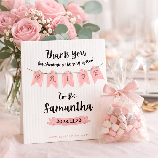 Thank you swedish cloth for the bride-to-be with a pink floral arrangement and candy bag.