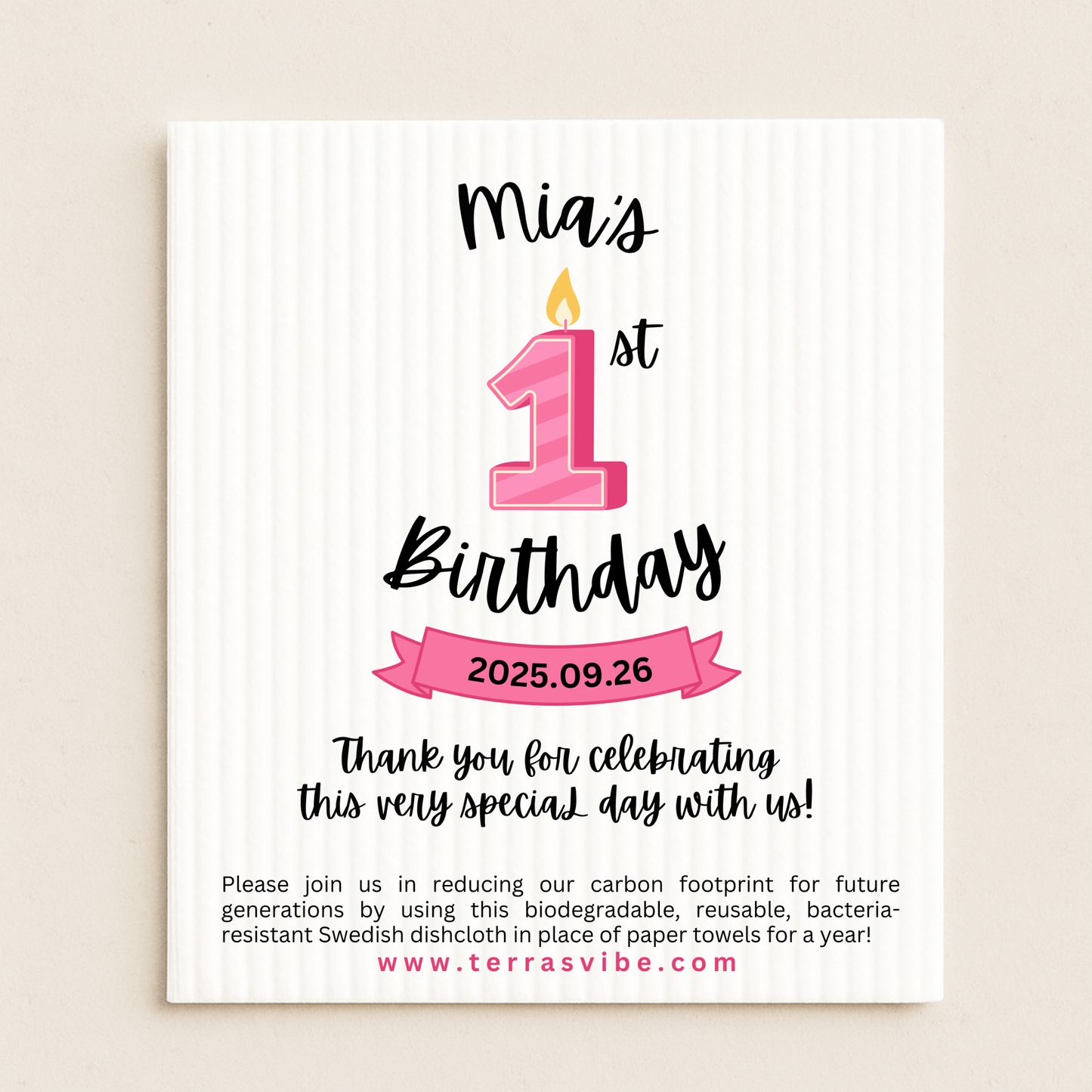 First birthday favor with pink candle design and text on a white swedish cloth