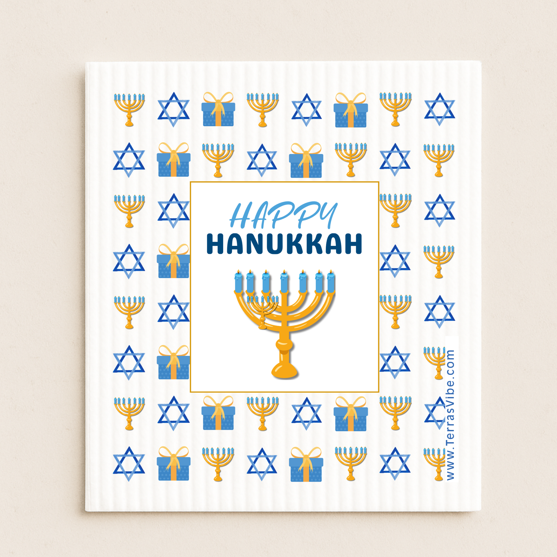 Happy Hanukkah cloth with menorah, stars of David, and presents on a white background.