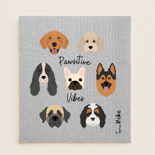 swedish cloth with illustrations of dogs' faces and text 'Pawsitive Vibes' on a gray background.