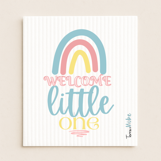 Decorative printed swedish cloth with rainbow and text 'Welcome little one' on a striped background